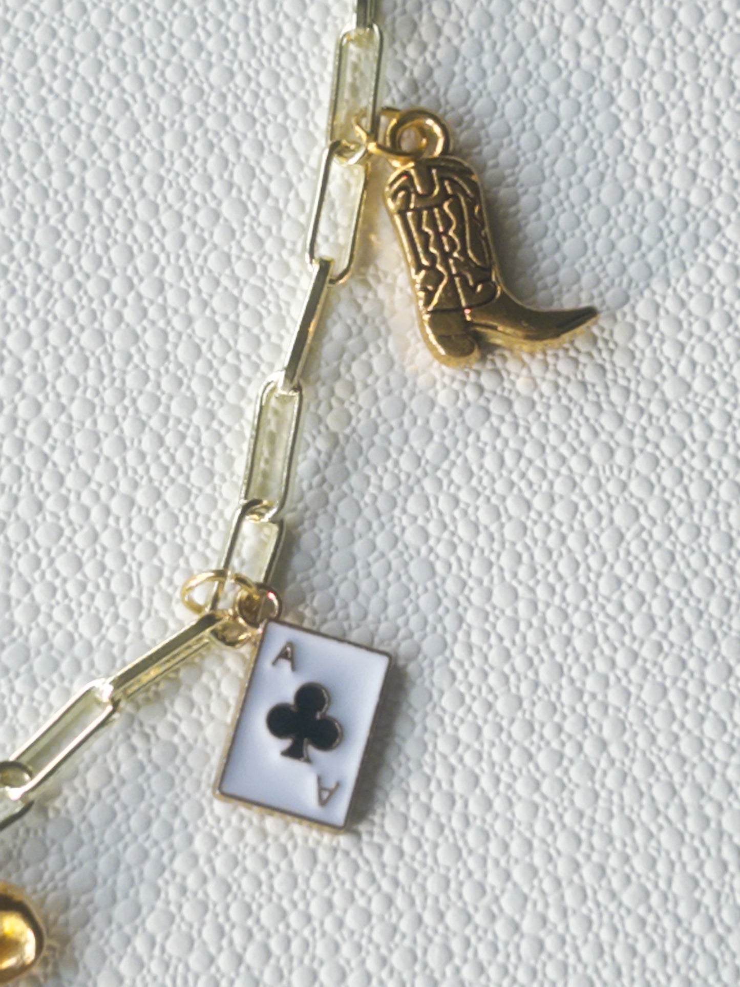 Gold bow charm necklace